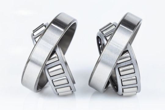 Close-up Tapered Roller Bearings spare part of mechanical on the white background..
