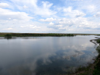 Landscape with lake and clouds