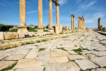 Fototapeta na wymiar Columns and old street of ruined Greco-Roman city of Gerasa