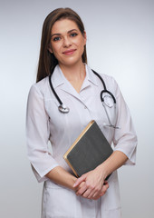 Young female medical worker holding book or journal.