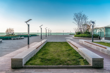 Floor tiles and seascape of city square..
