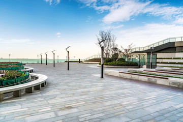 Floor tiles and seascape of city square..
