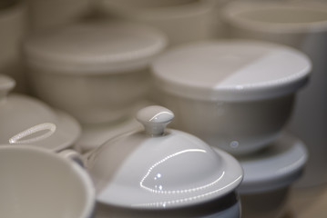 Obraz na płótnie Canvas White porcelain tea cup with blur background