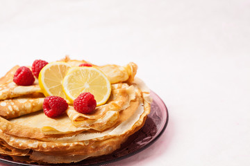 Folded pancakes on white marble background