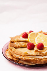 Folded pancakes on white marble background