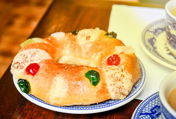 Traditional Mexican donut-shaped bread with sugar and cherries.