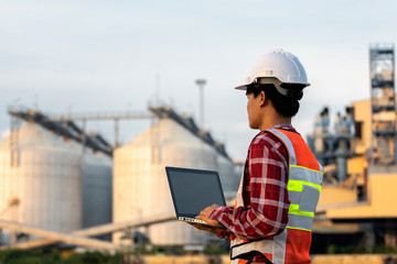 Engineer are working contruction on site plans to build high-rise buildings. Engineer building concept..