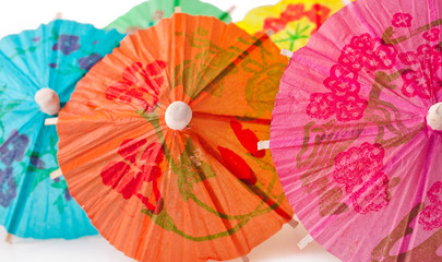 Background of cocktail paper umbrellas.