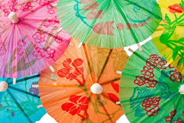 Background of cocktail paper umbrellas.