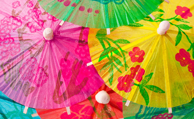 Background of cocktail paper umbrellas.