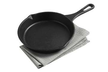 Empty iron pan and napkin isolated on white background