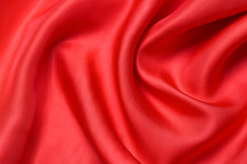 Fototapeta na wymiar expensive fabric texture. abstract background with soft waves. Smooth elegant red silk or satin luxury cloth