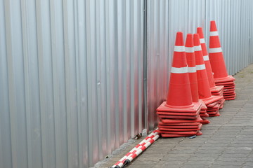Traffic cones are stacked after use.