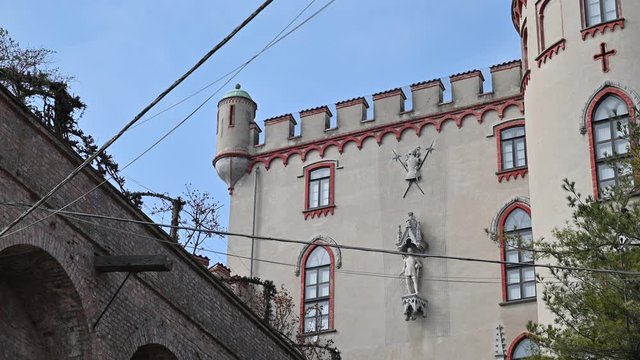 Costigliole d'Asti, Piedmont, Italy. March 2020. Wonderful side view of the castle, note the elegant red finish that gives elegance to the manor body. On the left the small watchtower.