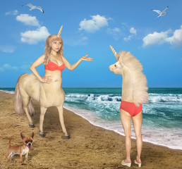 The female centaur meets the strange unicorn on the beach of the sea. She was very confused. Her dog is next to her. - obrazy, fototapety, plakaty