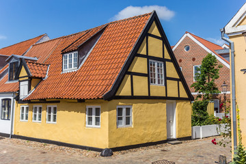 Fototapeta na wymiar Little yellow house in the old center of Ribe, Denmark