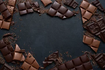 Fotobehang Slices of dark and milk chocolate. Top view with copy space. © lilechka75