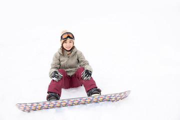 Fototapeta na wymiar スノーボードをする女性