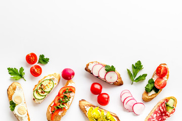 Sandwiches frame for menu design on white background top-down copy space