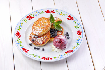 pancakes with ice cream and blueberries