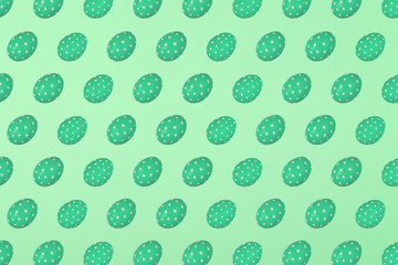 Green Easter eggs on a green background. Festive preparation, pattern, repetition, banner.