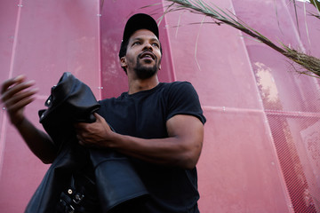 Black Caribbean man taking the walk outdoor.