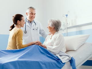 Doctor meeting a senior patient and her daughter