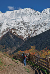 a man with backpack is in the mountains