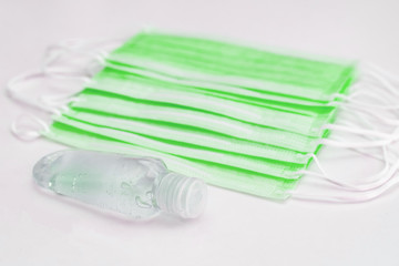 Disposable mask and hand sanitizer to prevent viruses spreading and protect yourself from influenza