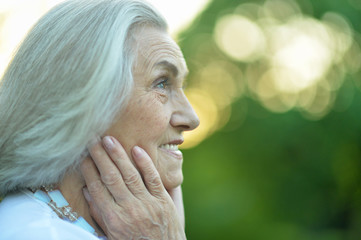Beautiful smiling senior woman in spring park