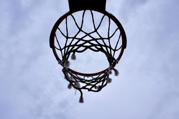 Fototapeta na wymiar basketball hoop silhouette in the street, street basket in Bilbao city Spain