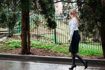 Young business woman walking outdoors in Park