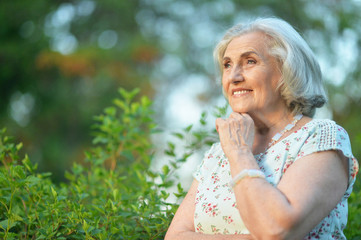 Fototapeta premium Happy senior beautiful woman in spring park