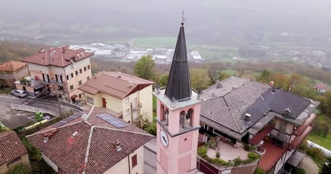 The Ancient Church Tower Of St. Antonio Abate In Crandola, Valsassina, Italy On A Foggy Day - Aerial Shot