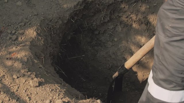 Worker dig ground with shovels dry soil gas accident leak repair emergency rescue service men in working uniform clothes closeup