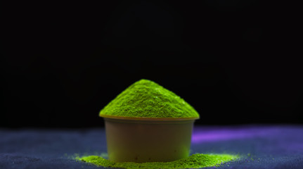 Concept: Indian colours holi festival. Colorful gulal (powder colors) for Happy Holi with copy...