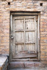 Fototapeta na wymiar Old wooden locked and brick wall