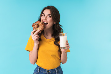 Woman holding milk and pastries.