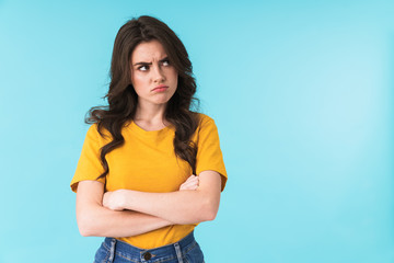 Confused displeased woman posing isolated