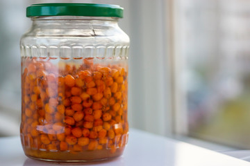 Glass jar with homemade sea buckthorn jam