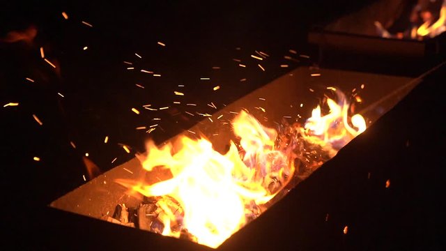 Brazier fire night scene barbecue camping camera movement slow motion
