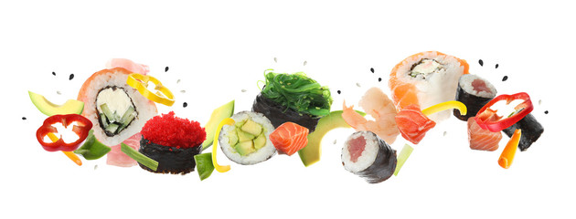 Different sushi rolls and ingredients on white background