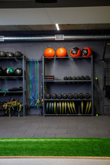 Close up of many metal dumbbells on rack in sport fitness gym center. Weight Training. Sport and fitness equipment and accessories.