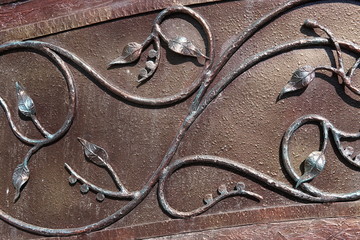 Elements of decorative floral ornament in a metal wrought fence.