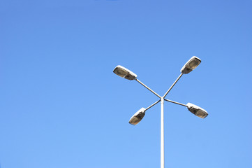 Street lamps with economical lamps with on a background of cloudless sky.