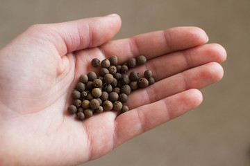 young woman holding black aroma papper in her hand