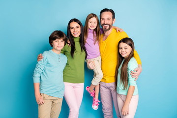 Portrait of nice attractive lovely adopted foster glad cheerful cheery family schoolkids mom dad...