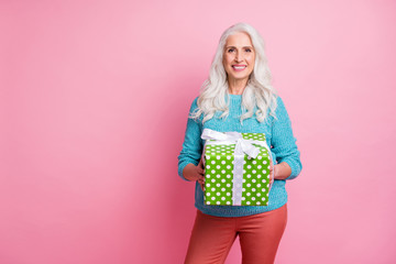 Portrait of charming granny hold big gift box she get receive from her grandchildren on 8-march family event celebration wear good look outfit isolated over pastel color background