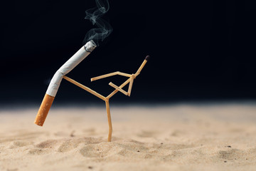 quit smoking concept - match man kick off a cigarette - obrazy, fototapety, plakaty