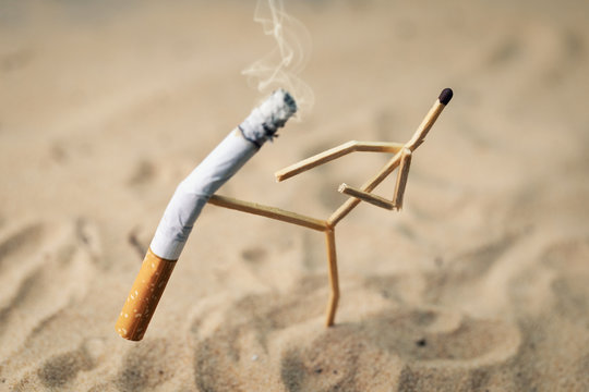 stop smoking; anthropomorphic match kicking cigarette